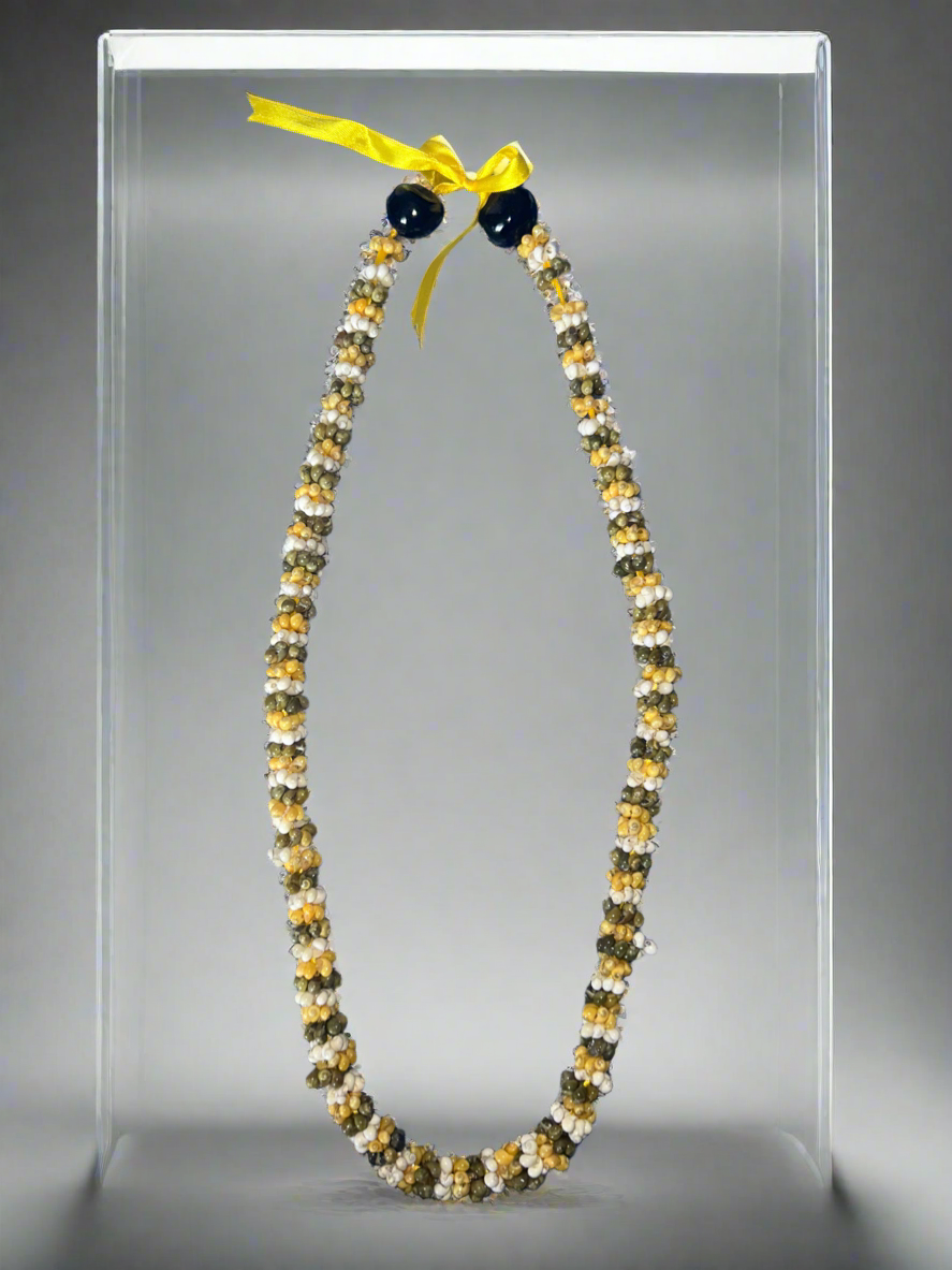 Yellow, white, and green lei
